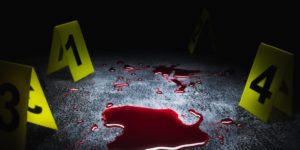 evidence markers on the floor with blood puddle, high contrast image
