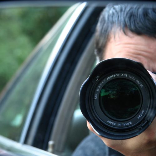 Paparazzi - Man taking photo from car